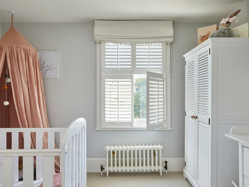 DIY shutters installed in a nursery room