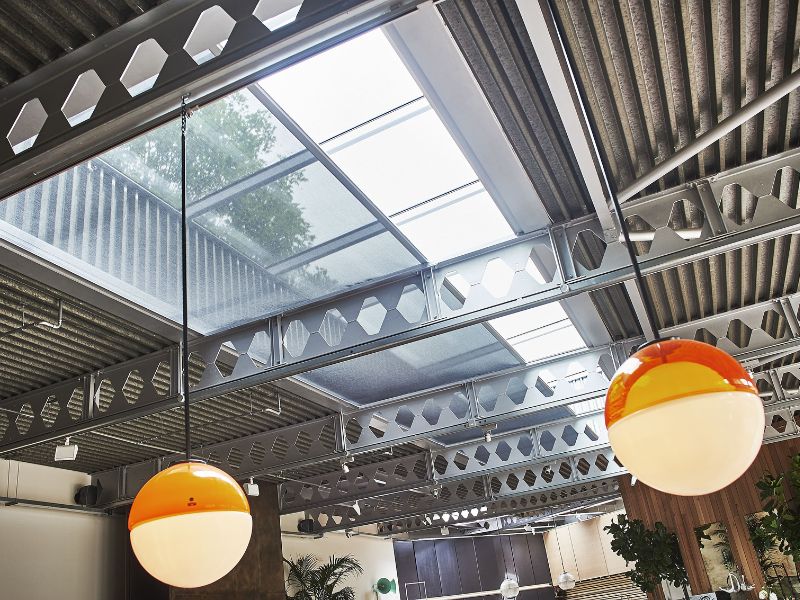 glass roof in a modern building with roller blinds