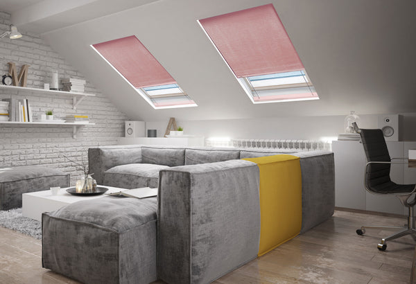 sky lights in a attic room with honeycomb blinds