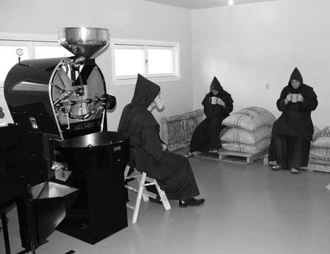 Mystic Monk Coffee monks enjoying the coffee fruit of their labor.