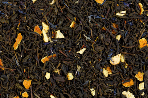 loose leaf earl grey tea leaves with blue cornflower blossoms and dried bergamot orange rinds