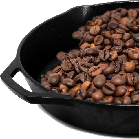 Mystic Monk Coffee beans roasted in a skillet.