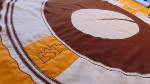 Custom flag showing brown MOD spec woven polyester fabric by Flag Studio