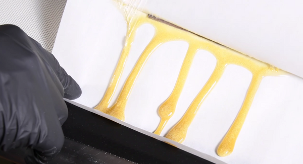 hash rosin being pressed on the Helix manual rosin press