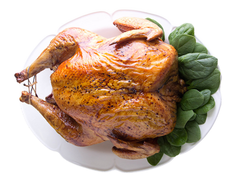 Image of cooked Joyce Farms Heritage Black Turkey on white platter