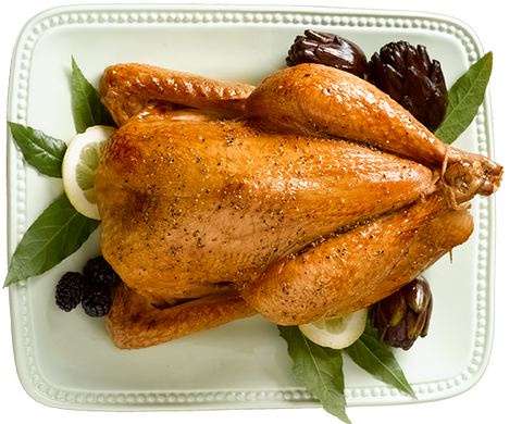 Image of cooked whole Poulet Rouge® Heritage Chicken from Joyce Farms on white plate