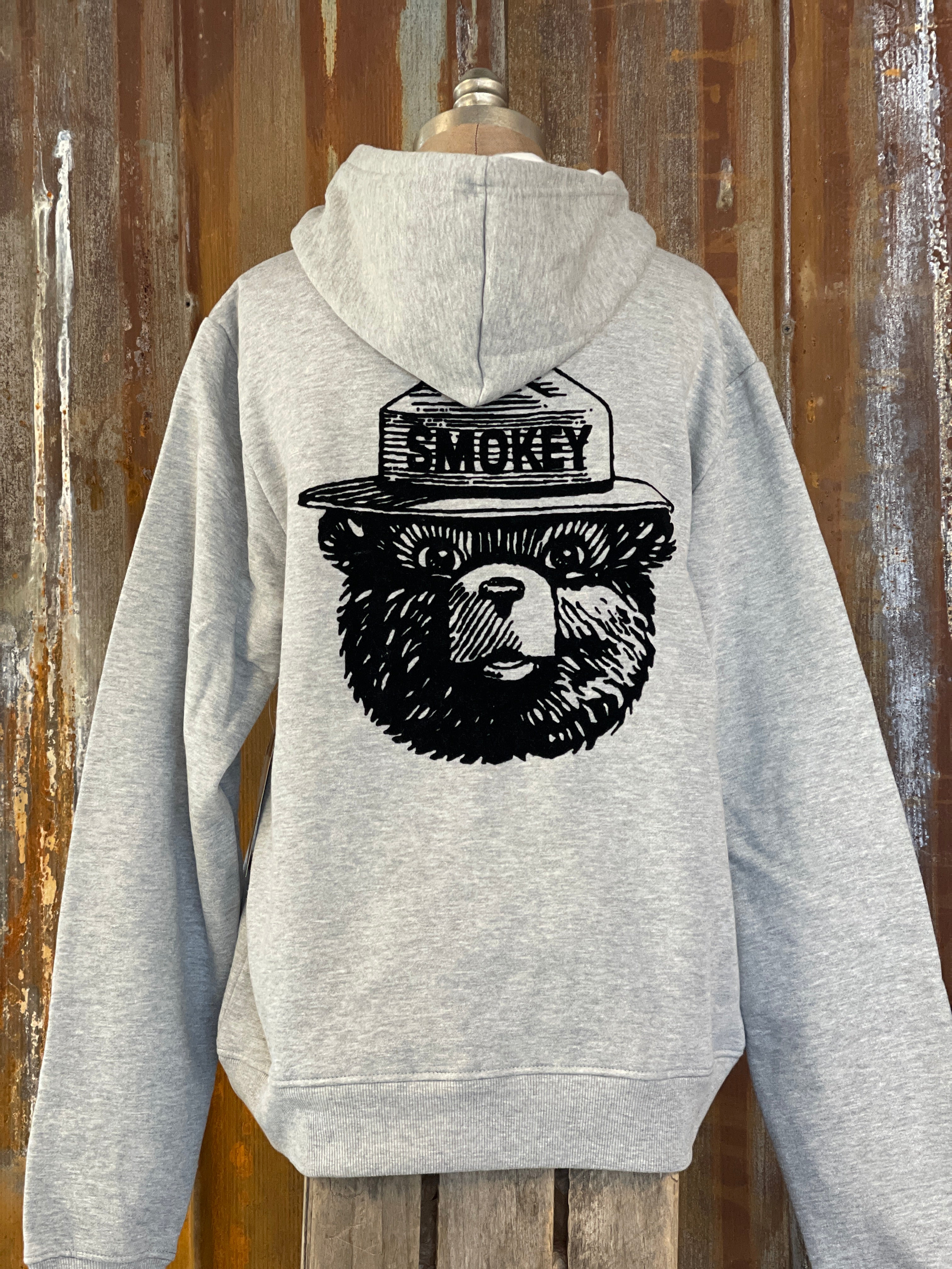 Image of Smokey Bear Graphic Hoodie- FLOCKED Heather Grey Sk disad ke .n..- e T.. R s .-l-. J.,.si 