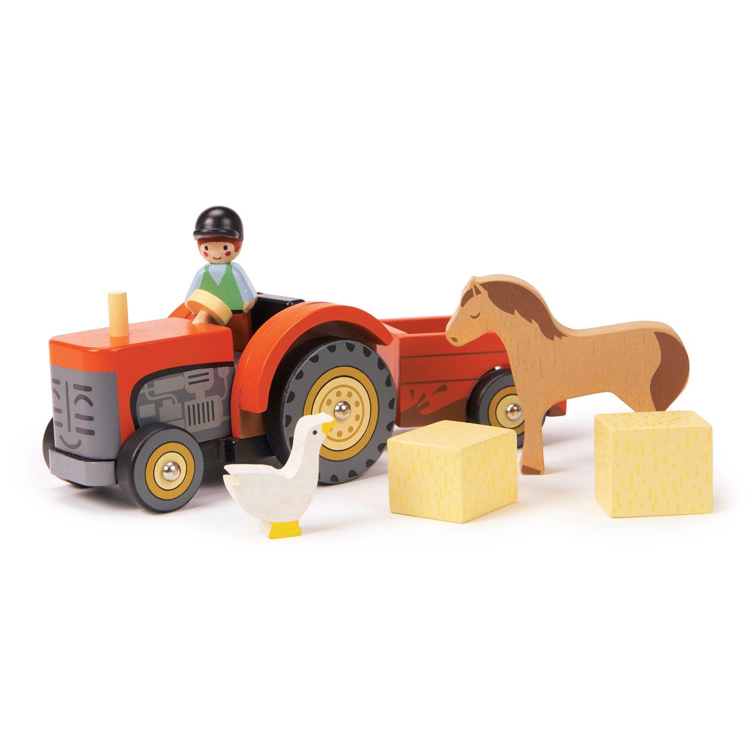 <p>A cheery farmyard tractor and removable trailer with driver, two hay bales, horse and goose. Made from wood and painted in bright red with illustrated details.</p>
<p>Age range: 18 months +  </p>
<p> Product size: 9.45 x 3.94 x 4.33”  </p>
<p> Weight: 1.12 lbs</p>
<p><strong>Related Product</strong><a href="https://kids.allwomenstalk.com/products/tender-leaf-farm">Tender Leaf Farm</a></p>
<p><a href="https://www.dropbox.com/s/gcuqmfs5k6ovhoz/TL8485%20Farmyard%20Tractor%20Printable.pdf?dl=0"><strong>Download Tractor Trails Printable</strong></a></p>
