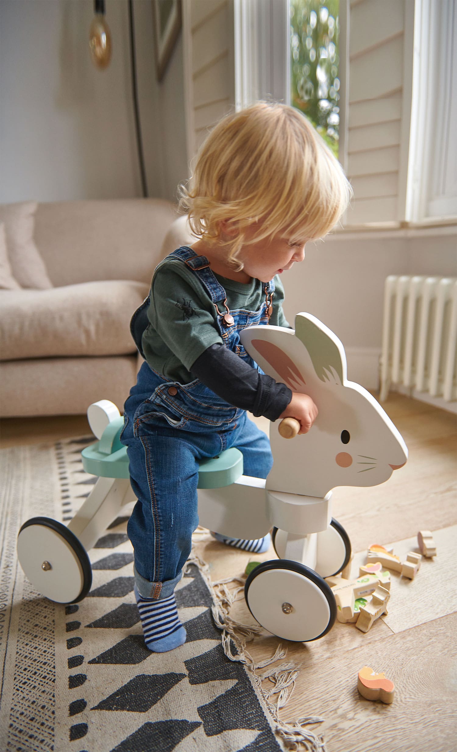 Tender Leaf Toys - Running Rabbit Ride On - Wooden Four Wheeled Push Balance Rabbit Themed Bike with Rubber Ring and Handle - Early Walk Development and Muscle Strength Enhancement for Children 18M+
