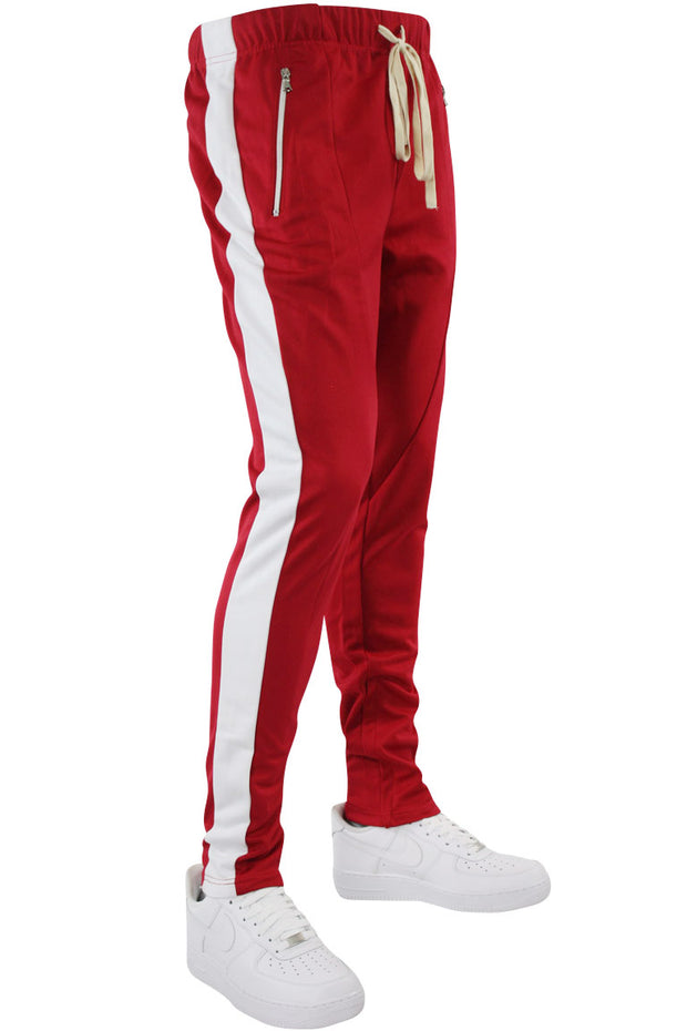 red track pants with white stripe