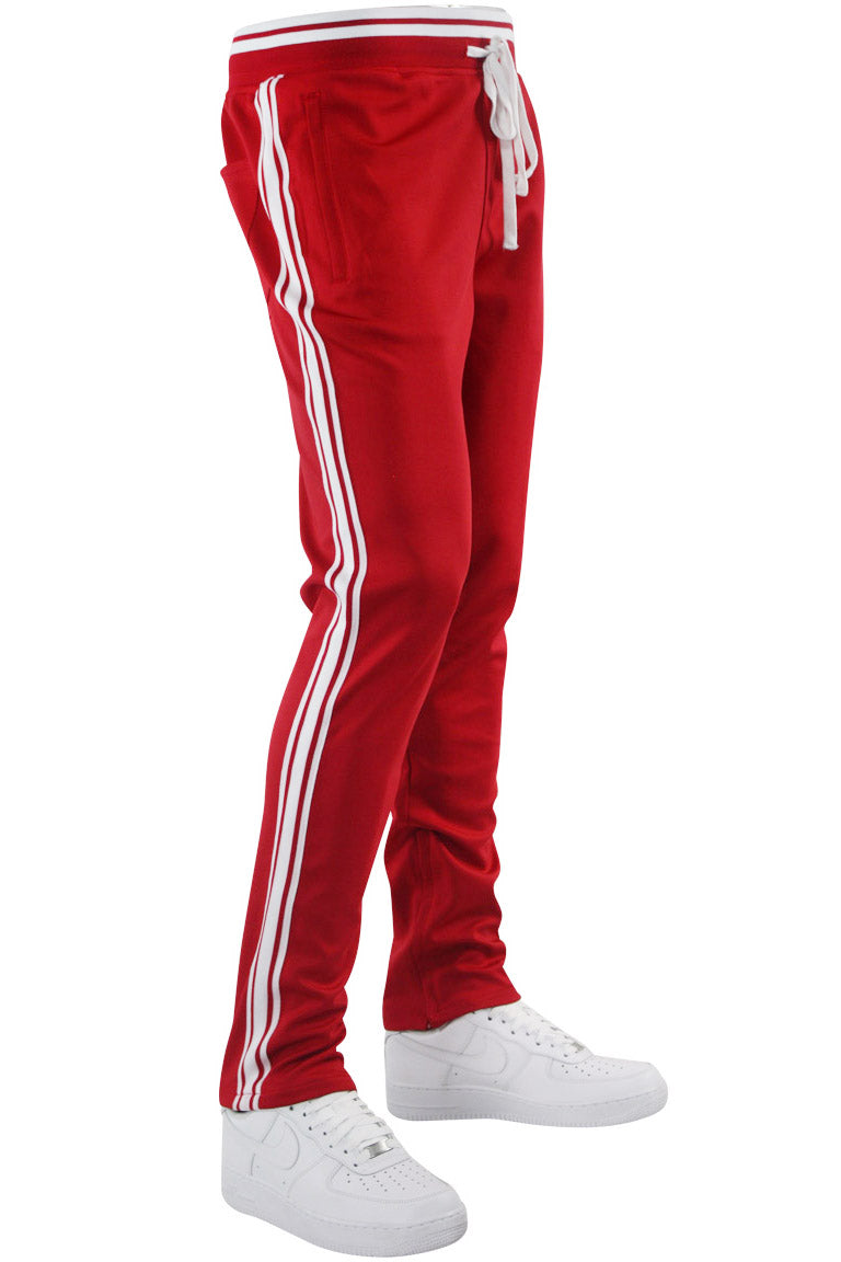 red track pants with white stripe