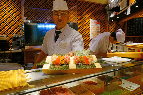 View of a Itamae offering an omakase sushi menu in a Japanese restaurant in Tokyo, Japan