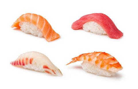 Nigirizushi set on a white background, raw fish usually is used as the neta