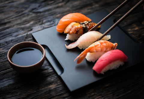 Close up of Nigirizushi set with chopsticks and soy sauce