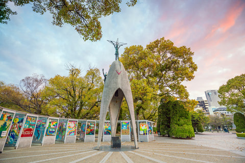 The Children's Peace Monument with a statue of a girl holding a folded paper crane, in Hiroshima Peace Memorial Park, Japan.