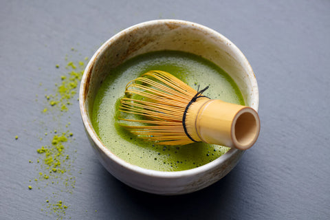 Traditional whisk and Japanese matcha tea