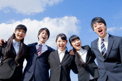 Japanese business Man and Business Woman partnering the shoulder