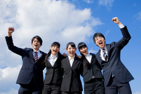 Japanese business Man and Business Woman partnering the shoulder