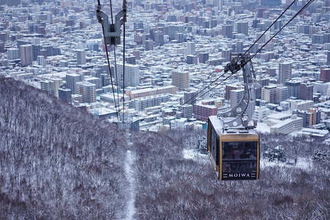 The Mount Moiwa Ropeway is climbing from the base of the mountain to the top to see panoramic view in winter of Sapporo, Hokkaido