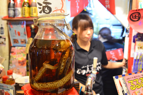 Alcoholic "Awamori" with snakes inside, at the restaurants in Naha city.