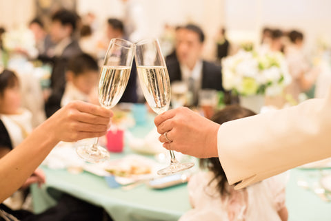 Women with champagne glasses at wedding reception in western style wedding