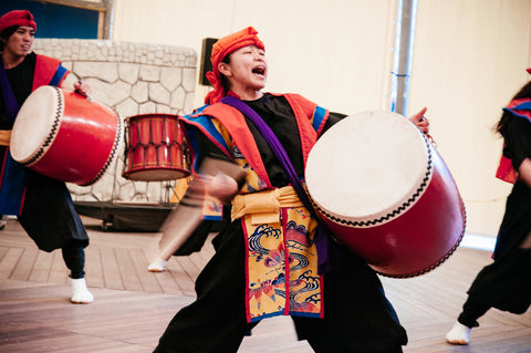 Okinawa Eisa drum dance with active dancer in traditional cloth