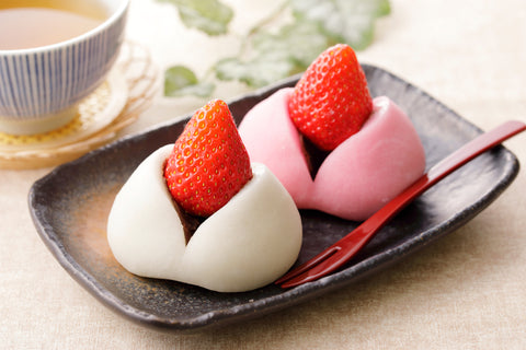 Strawberry daifuku. Is a soft rice cake stuffed with sweet bean paste and a strawberry.