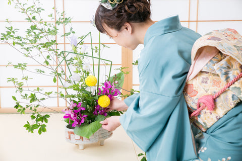 Woman wearing kimono and flower arranging