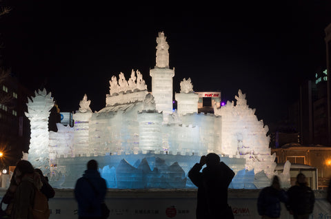 Illuminated ice sculpture of an imaginary castle at Sapporo Snow Festival on February
