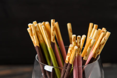 Pocky is a snack that features biscuit sticks dipped in chocolate.
