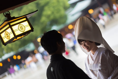 Photo of young groom and bride during Japanese traditional wedding ceremony at Meiji-jingu shrine