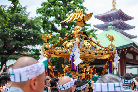Men carrying a portable shrine (mikoshi) at the Sanja Festival in Asakusa. one of Tokyo's the most popular festivals.