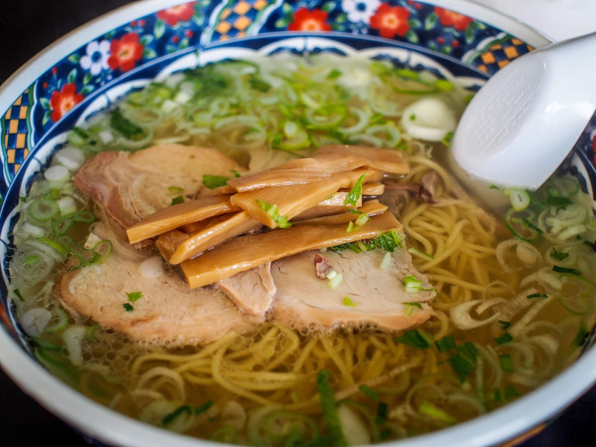 simple Hakodate ramen made with salt broth, roasted pork, bamboo and scallions