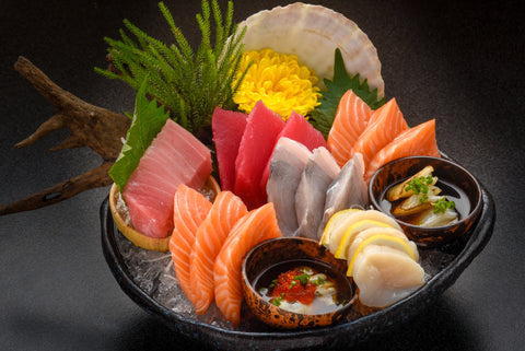 many eat Sashimi Japanese food, Sashimi set. Salmon, wasabi, fish, shrimp to celebrate dad in Japan