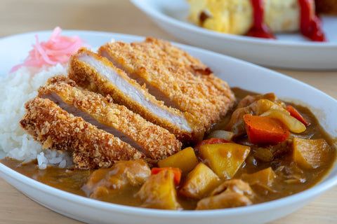 A serving of kare-raisu, or Japanese curry rice, with katsu and ginger.