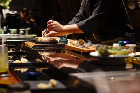 Japanese Chef making uni nigiri omakase style eating.