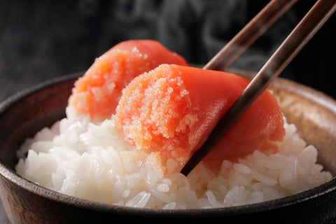 Mentaiko over a steaming bowl of rice.