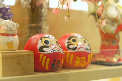 Japanese Daruma dolls or dolls of fortune in the souvenir shop.