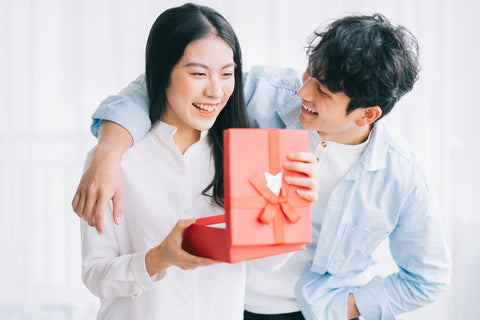 Man giving woman Valentine's Day gift
