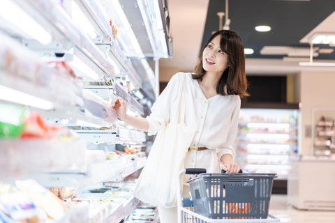 Young business person shopping at the konbini