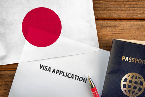 Visa application form, passport and flag of Japan