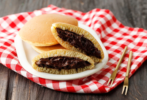 Dorayaki is one of the best Japanese snacks. This sweet snack is usually made with two pancakes and a filling (usually red bean paste).