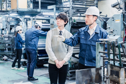 Male students touring the factory