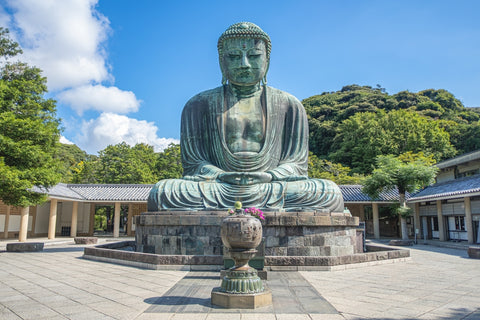 The great blue buddha statue Kamakura Daibutsu at Kotoku in shrine temple if you are visiting Kamakura,Kanagawa, Japan