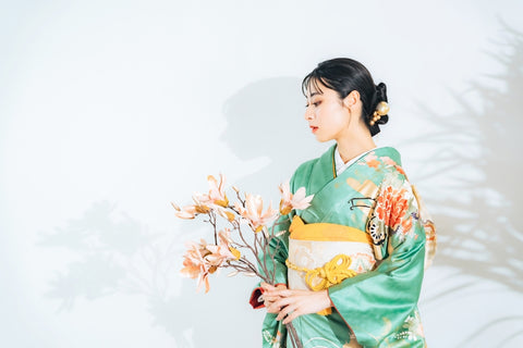 Portrait of an average Japanese woman wearing kimono with flowers. Japanese traditional dress.