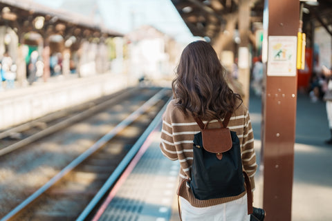 Woman tourist waiting train and Visiting in Kamakura, Kanagawa, Japan.