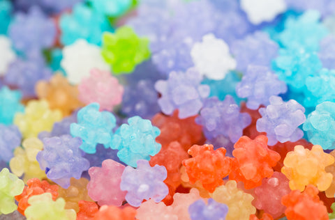 Konpeito is a hard candy made from sugar that comes in various flavors, including vanilla, plum, peach, and mango.