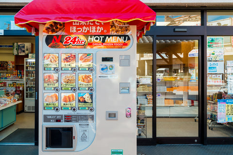 Food vending machine in front of a convenience store (hot meals)