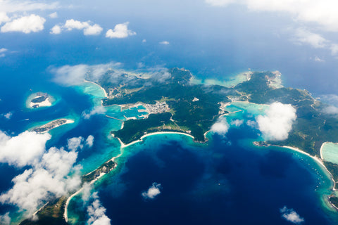 erial view of the Japanese tropical islands surrounded by coral reefs with clear blue water, Kerama Islands, Okinawa, Japan