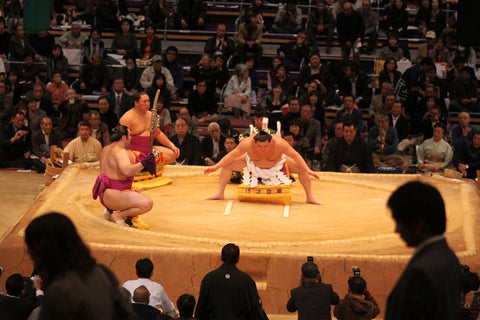 high ranking sumo wrestlers Yokozuna performing an opening ceremony in the arena